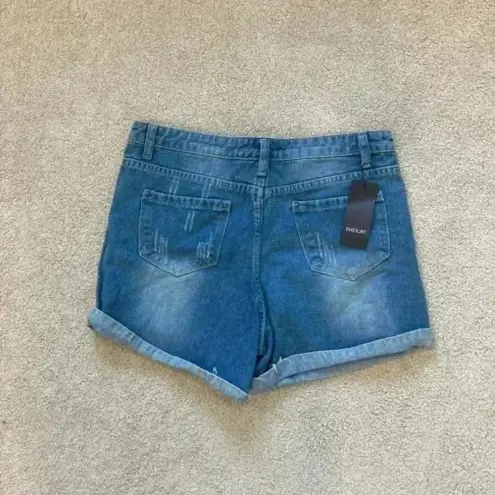 New with tags sheilay high rise ripped jean shorts in size medium Blue