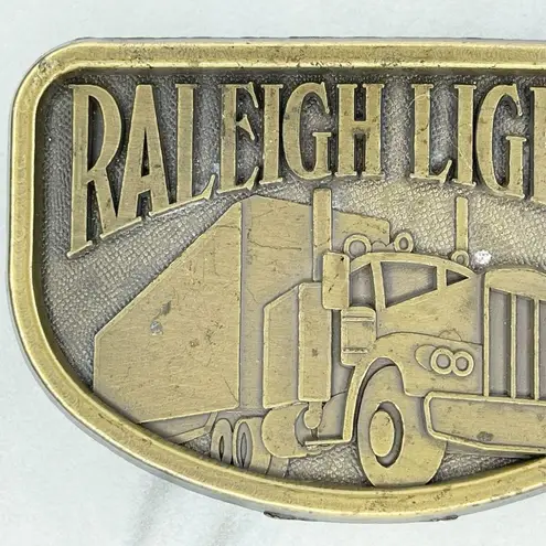 Vintage Raleigh Lights Tobacco Cigarette Truck Trucking Belt Buckle