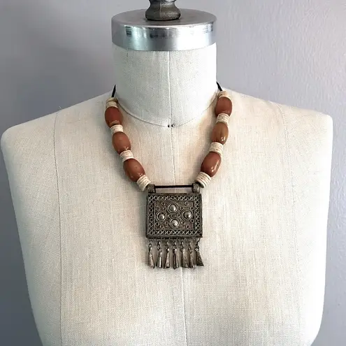 Handmade Vintage authentic African tribal necklace with metal center amber colored beads