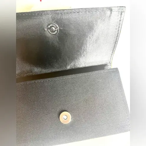 Tribal print and black small clutch black with tassel on the zipper snap closure