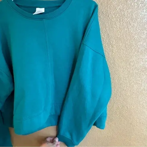 All In Motion  Lot-two cropped sweatshirts in size xs in both teal and hot pink