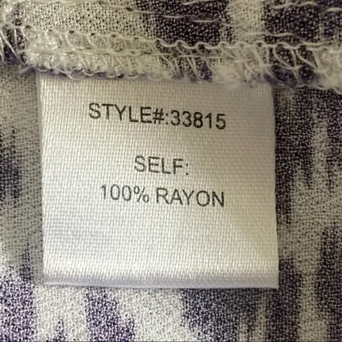 Skies Are Blue navy and white top with back cut-outs in size Medium. EUC