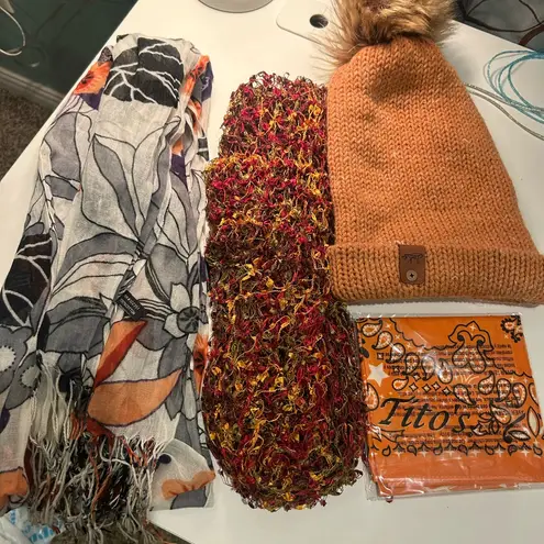 Beautiful bundle of ladies cozy accessories in autumn earth tones scarves hat Orange