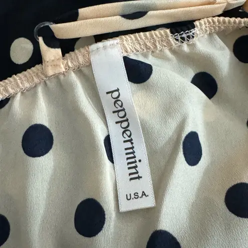 Peppermint Two-tone polka dot dress:
Elegant dress with a strappy design