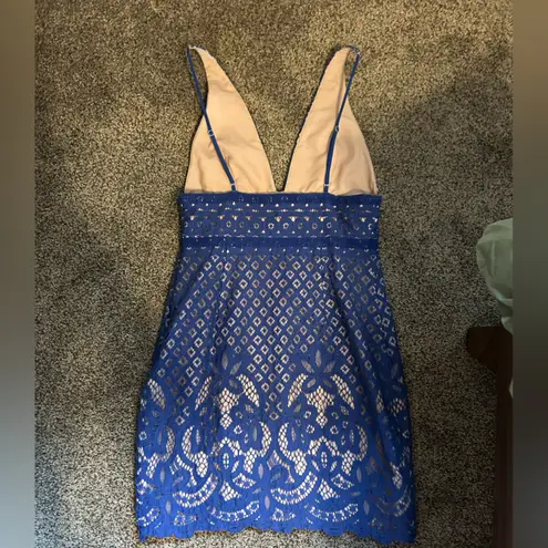 Stylestalker Blue Lani mini dress. Blue lace tan lined deep V spaghetti strap