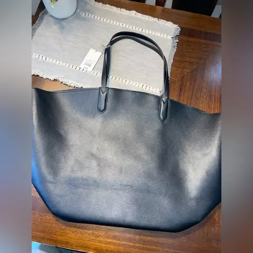 New woman’s black faux leather tote bag