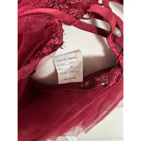 Prom Bay size 6 prom dress in the color wine. Corset with Lace up back & Ruffles Red