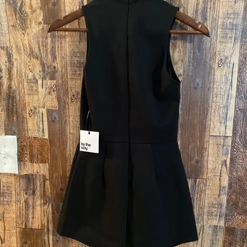 by the way. NWT black romper Low neck size XS