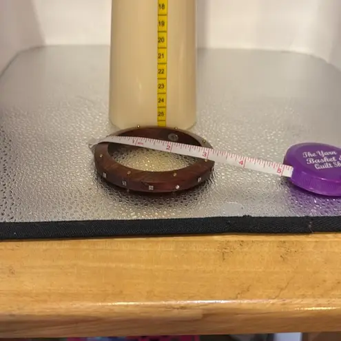 Silpada wooden bracelet with sparkle embellishments on the wood.