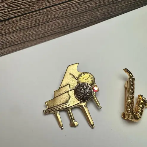 Piano & Saxophone Musical Instruments Lot Of 2 Brooch Pin Rhinestone / Gold Tone