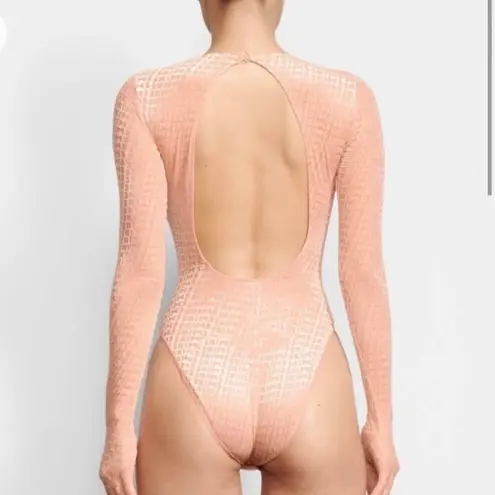 SKIMS Velvet Glove Bodysuit in Peach Orange Pink Open Back Gloved Cheeky Catsuit