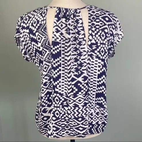 Skies Are Blue navy and white top with back cut-outs in size Medium. EUC
