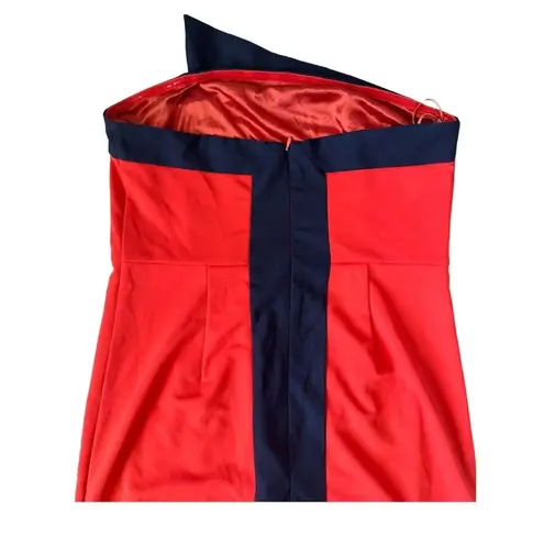 C. Luce Orange with Navy trim strapless dress Size S
Excellent condition