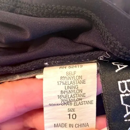 La Blanca || Black/pink/green/white one piece swimsuit with ruffle and ruching