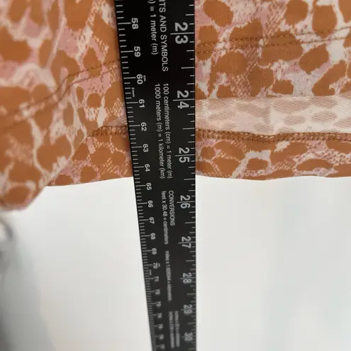 Laila Ali tan & pink animal print long sleeve shirt with tie up front and hood. Size XS