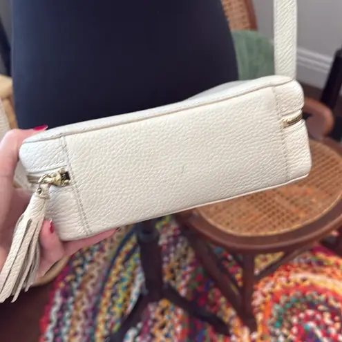 Cuyana Cream Pebbled Leather Tassel Zip Crossbody Camera Bag