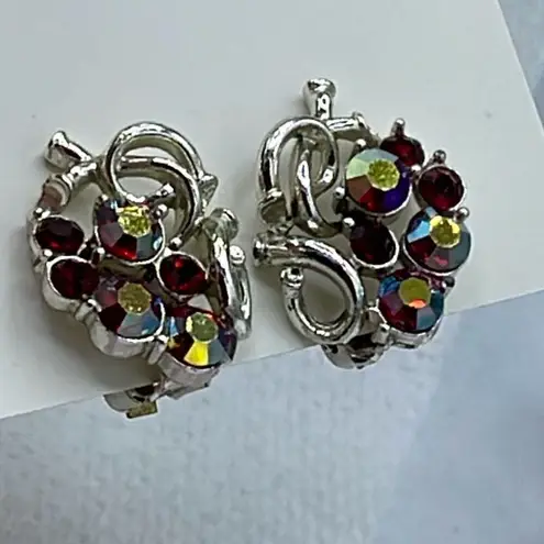 Vintage Star AB coated red cut glass silver tone metal clip earrings.