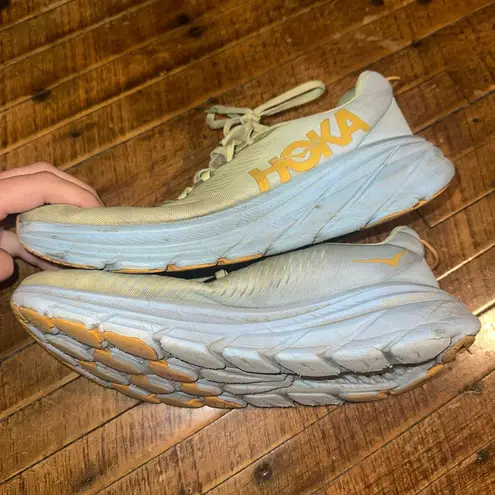 Hoka One One light green athletic running 10 sneakers