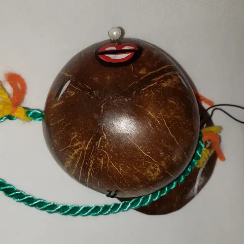 Coconut souvenir purse with painted face pearly bead nose & yarn handle Green