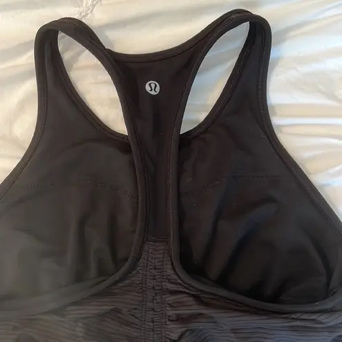 Lululemon Lululemmon black racerback tank top. Built in bra. Ruched back. Size 6