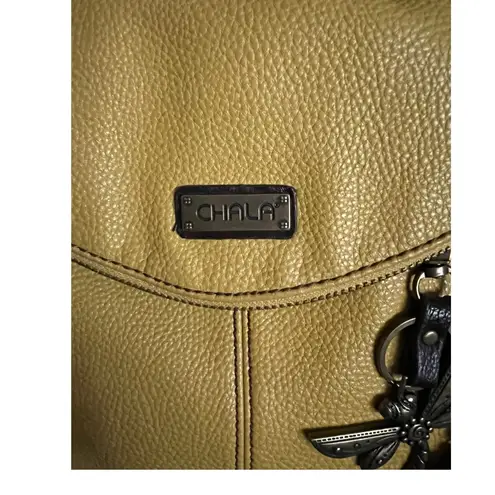 CHALA Mustard Pebbled Leather Crossbody Handbag with Dragonfly Charm.