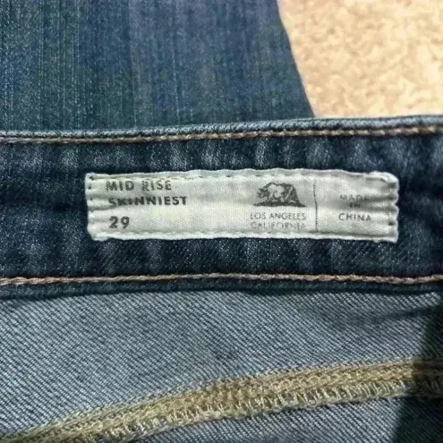 Bullhead mid rise skinniest blue jeans in size 29