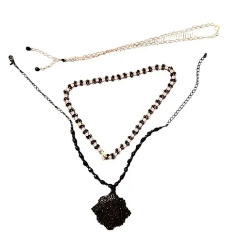 3 necklaces in black, black and gold, black and white colored EUC