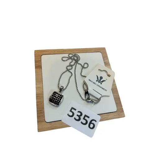 Silver toned and burgundy red rhinestone pendant necklace Gray