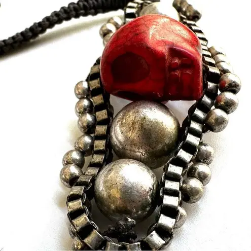 Silver tone red skeleton black cord bracelet