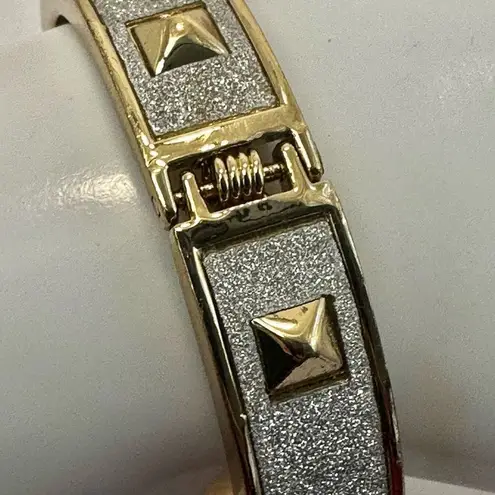 Silver and gold tone spiked bangle bracelet