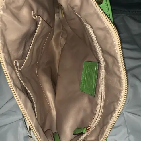 Coach  hobo-style crossbody purse, beige signature with green leather trim.