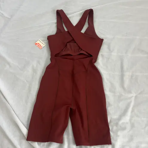 Free People Movement Here On Out Strappy Onesie Romper   Size XS  Condition: NWT  Color: nutmeg  Details : - See photo for approx. inseam measurement laying flat  - Built-in bra - not padded - Side pockets.