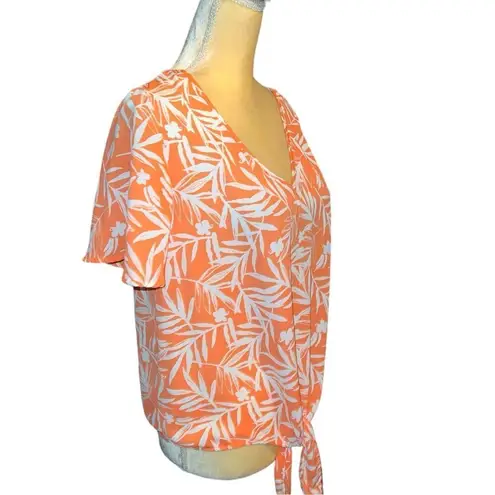 Nine Britton  cute new white tie front top with orange floral design.