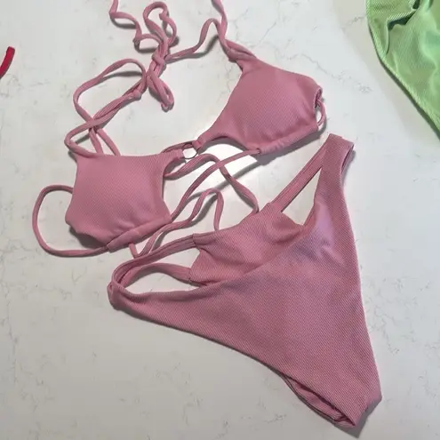 A lot of 5 sets of string bikinis. Tags have all been removed. Sizes are Small Size undefined