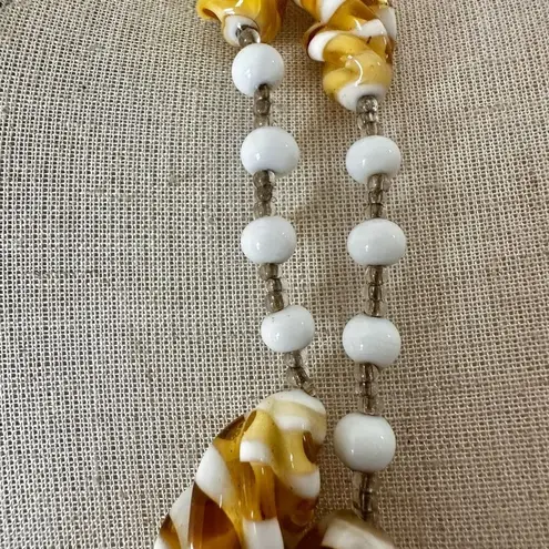 White and yellow swirl long beaded necklace