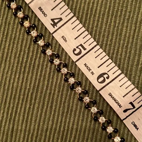 3 necklaces in black, black and gold, black and white colored EUC