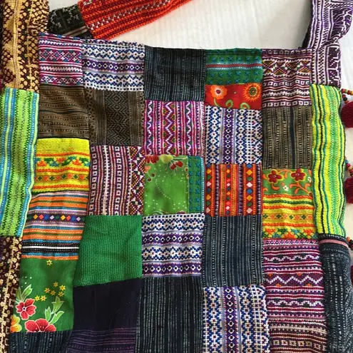 PATCHWORK BOHO SLING STYLE CROSSBODY COLORED PATCHES WITH RED BALL TASSELS