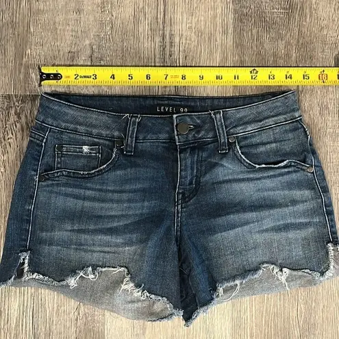 Level 99 dark denim wash slight distressed w/ side hem slit fray at hem