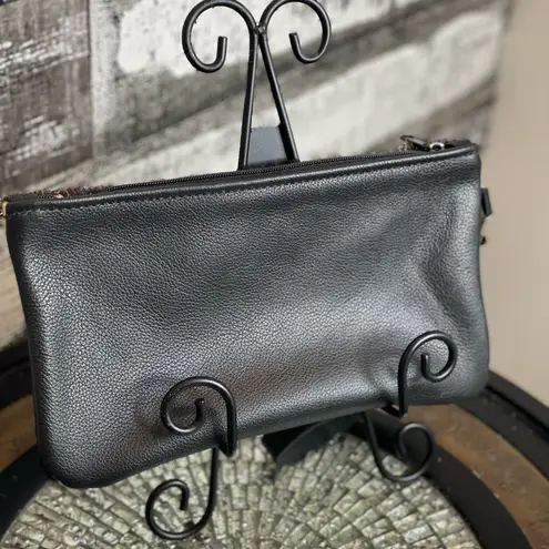 Metallic leather acid wash black and gold wristlet With removable strap.