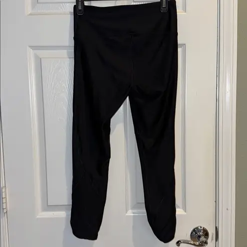 Under Armour  Black Compression Leggings
With Details Sides Size Medium