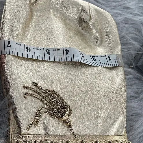 Vintage gold shimmering faux leather glam handbag with tassel. Gold
