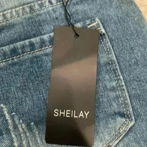 New with tags sheilay high rise ripped jean shorts in size medium Blue