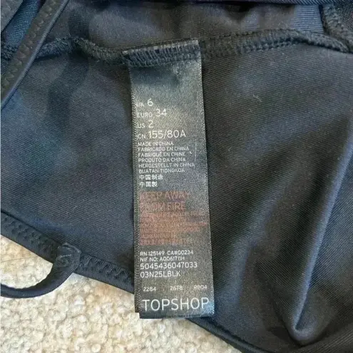 Topshop  black mesh open backed one piece swimsuit in size 6