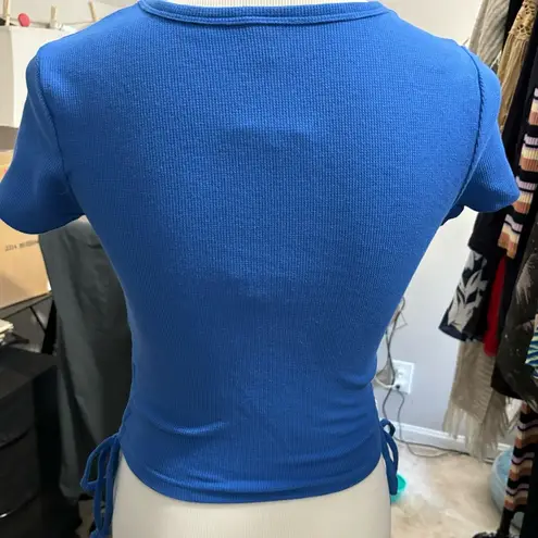 Chicka-d , NWT Blue ribbed crop top with ruching and ties on sides. Small