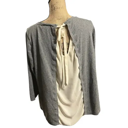 Unknown brand, unknown size sweater with dual fabric back and ties. Gray