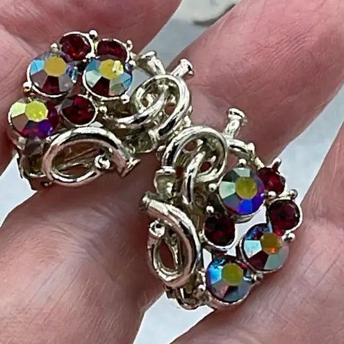 Vintage Star AB coated red cut glass silver tone metal clip earrings.