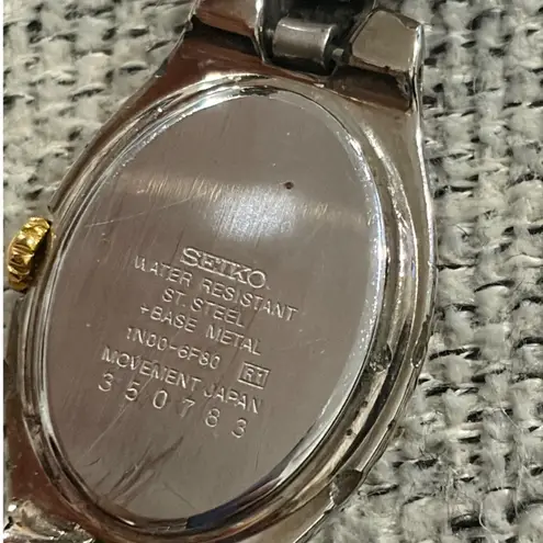 Seiko Oval Women's Two Tone Silver and Gold Wrist Sunburst Dial Watch 1N00-6F80