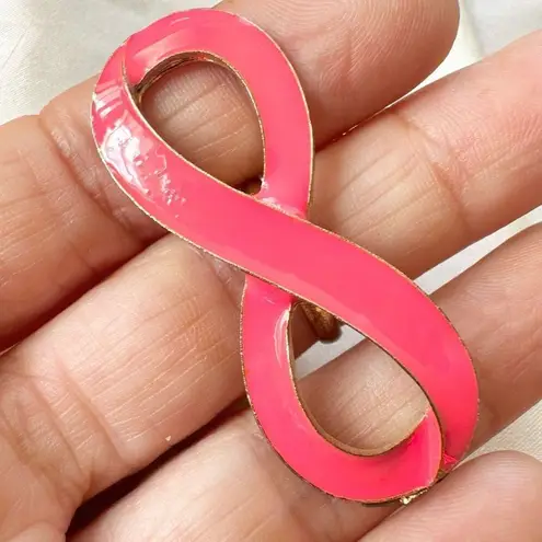 Pink and gold tone infinity ring