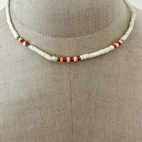 Shell and pink beaded puka necklace