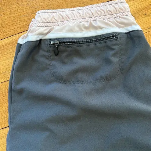 Nike 𝅺 grey pink and white lined track pants size L (12-14)